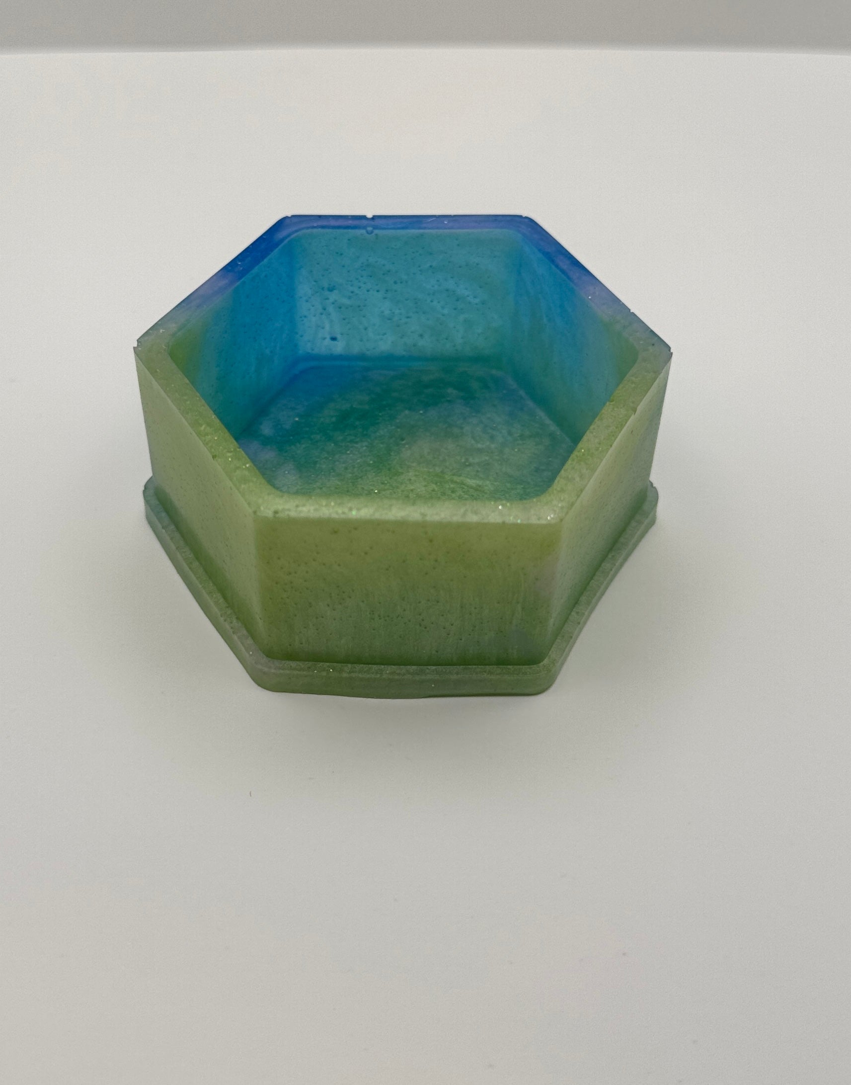 Mermaid Lagoon hexagon resin dish from the side, showing blue interior and sage green exterior walls