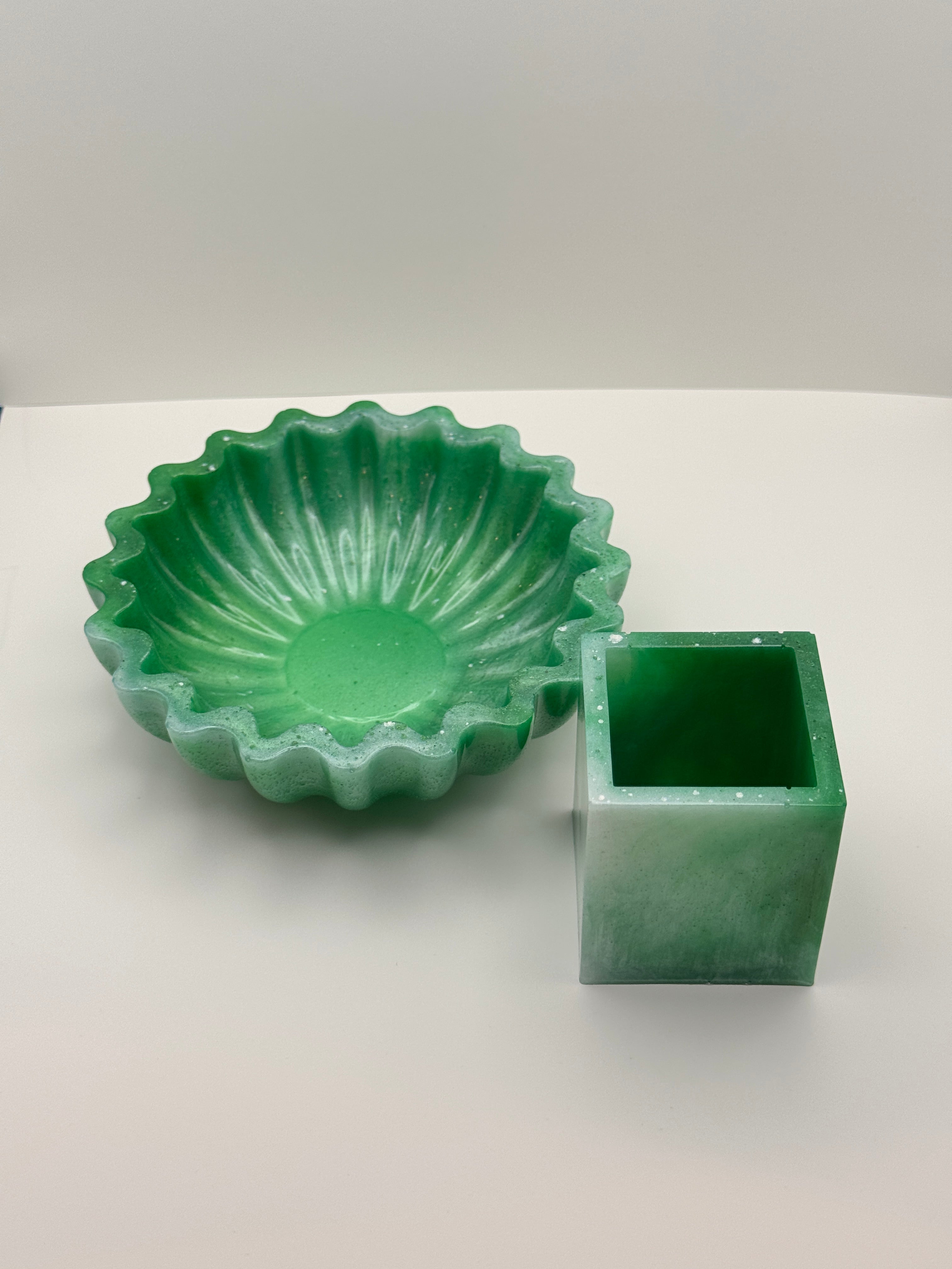 Emerald green resin bowl and cube vessel set, overhead flat lay